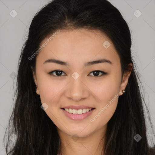 Joyful asian young-adult female with long  brown hair and brown eyes