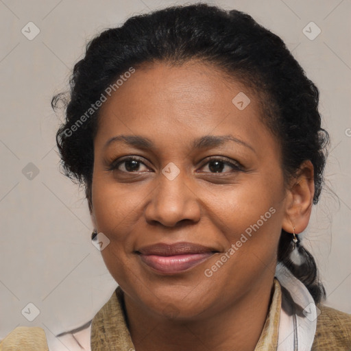 Joyful black adult female with short  brown hair and brown eyes