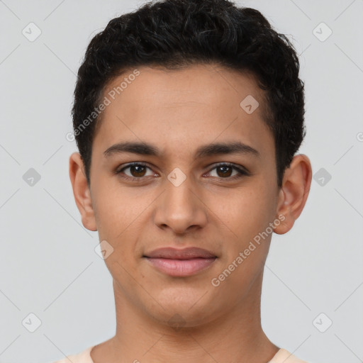 Joyful latino young-adult male with short  brown hair and brown eyes