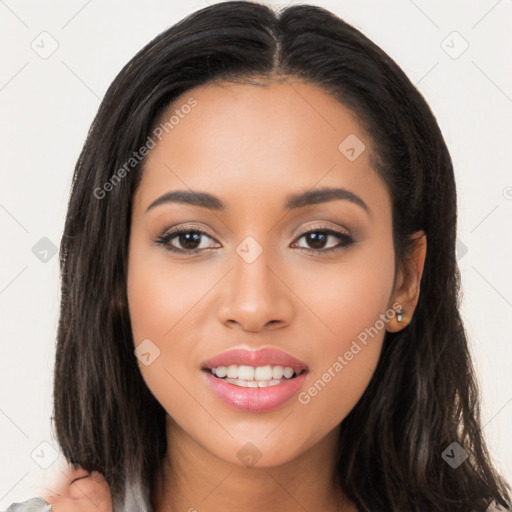 Joyful latino young-adult female with long  black hair and brown eyes