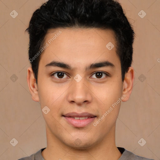 Joyful latino young-adult male with short  brown hair and brown eyes