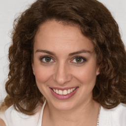 Joyful white young-adult female with medium  brown hair and green eyes