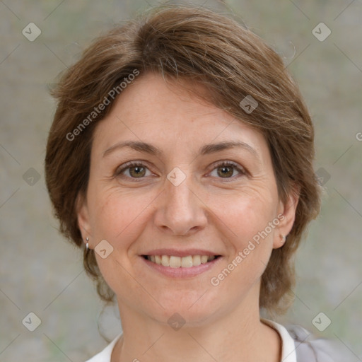 Joyful white adult female with medium  brown hair and grey eyes