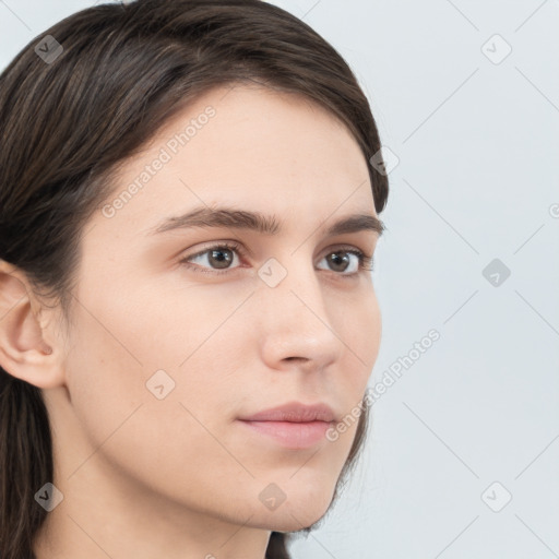 Neutral white young-adult female with long  brown hair and brown eyes