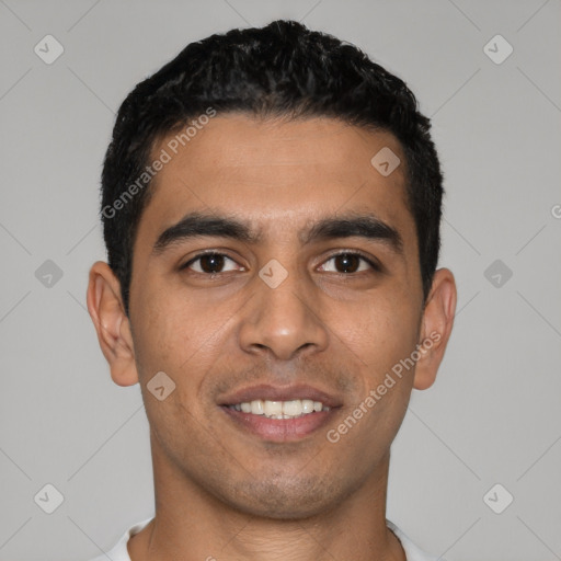 Joyful latino young-adult male with short  black hair and brown eyes