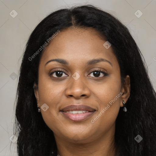 Joyful black young-adult female with long  black hair and brown eyes