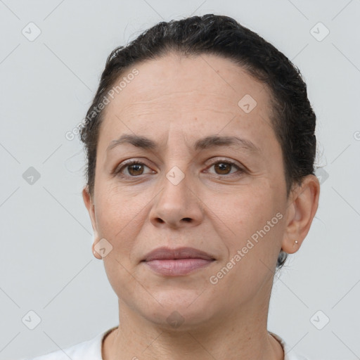 Joyful white adult female with short  brown hair and brown eyes