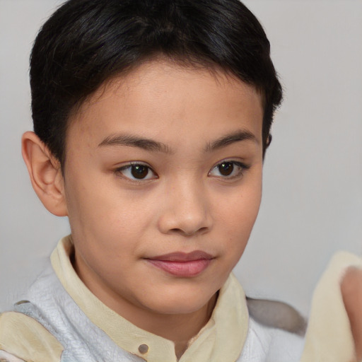 Joyful asian child female with short  brown hair and brown eyes