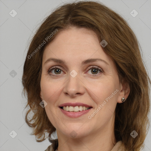 Joyful white adult female with medium  brown hair and grey eyes