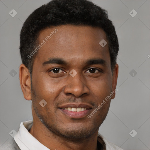 Joyful black young-adult male with short  brown hair and brown eyes