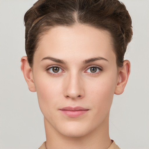 Neutral white young-adult female with short  brown hair and brown eyes