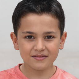 Joyful white child male with short  brown hair and brown eyes