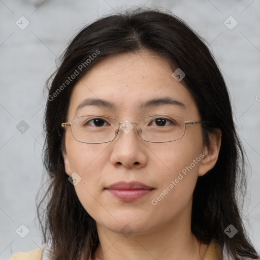 Joyful white adult female with long  brown hair and brown eyes