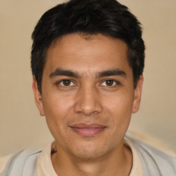 Joyful asian young-adult male with short  black hair and brown eyes