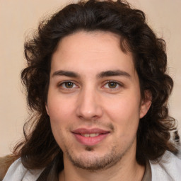 Joyful white young-adult male with medium  brown hair and brown eyes