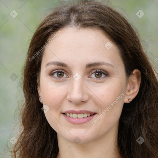 Joyful white young-adult female with long  brown hair and green eyes