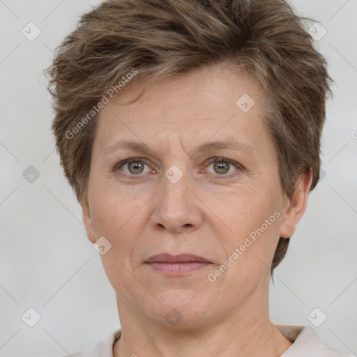 Joyful white adult female with short  brown hair and grey eyes