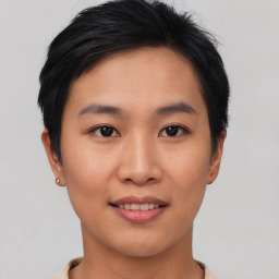 Joyful asian young-adult female with short  black hair and brown eyes