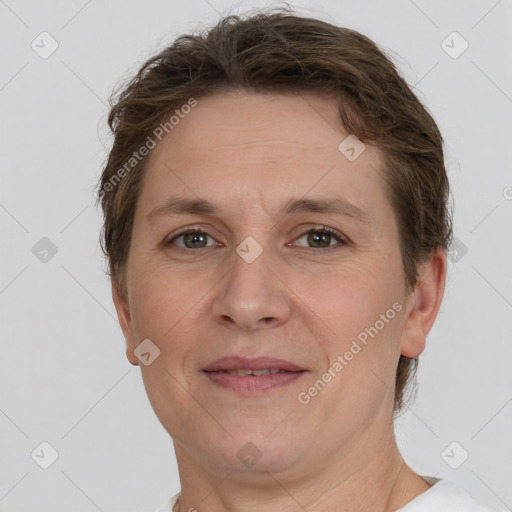 Joyful white adult female with short  brown hair and grey eyes