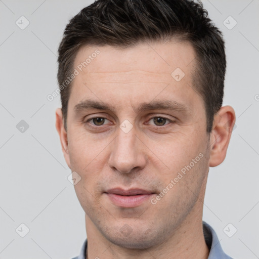 Joyful white adult male with short  brown hair and brown eyes