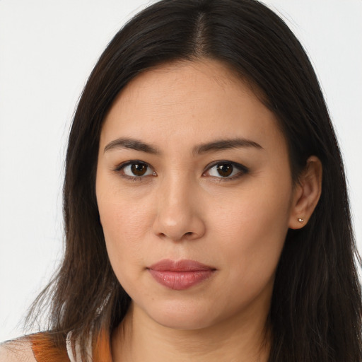 Joyful asian young-adult female with long  brown hair and brown eyes