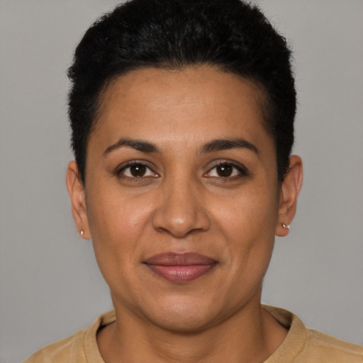Joyful latino young-adult female with short  brown hair and brown eyes