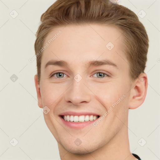 Joyful white young-adult male with short  brown hair and grey eyes