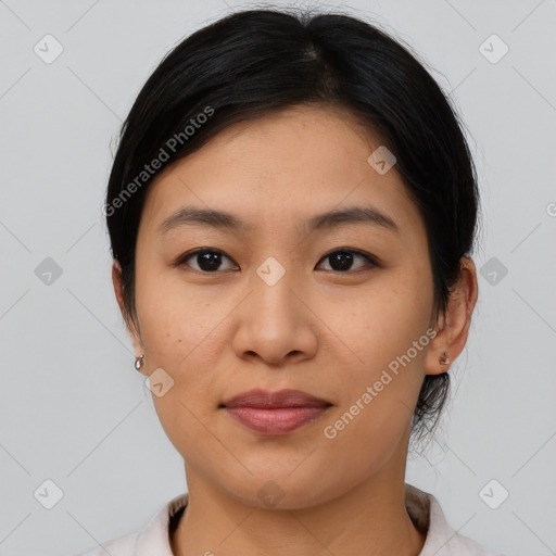 Joyful asian young-adult female with medium  black hair and brown eyes