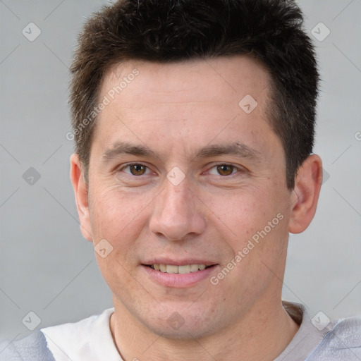 Joyful white adult male with short  brown hair and brown eyes