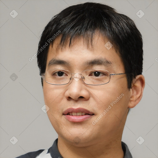 Joyful asian young-adult male with short  brown hair and brown eyes