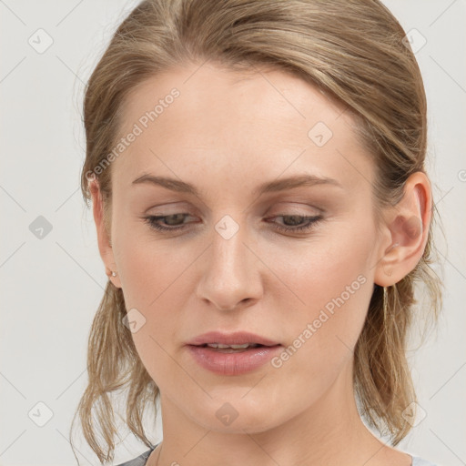 Joyful white young-adult female with medium  brown hair and blue eyes