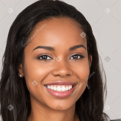 Joyful latino young-adult female with long  brown hair and brown eyes