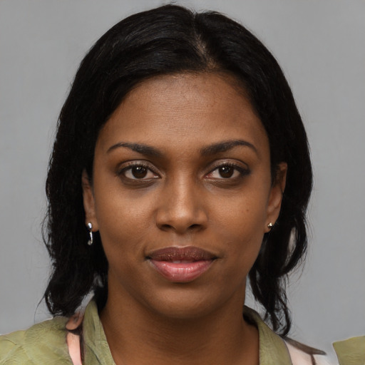 Neutral black young-adult female with medium  black hair and brown eyes