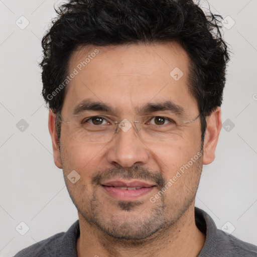 Joyful white adult male with short  black hair and brown eyes