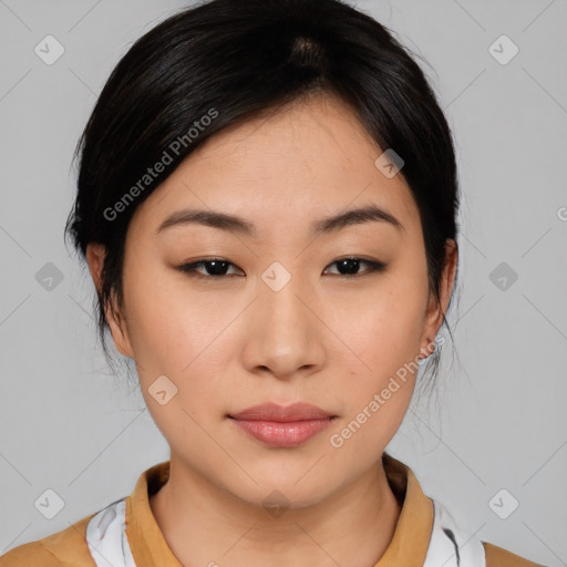 Joyful asian young-adult female with medium  black hair and brown eyes