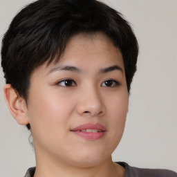 Joyful asian young-adult female with short  brown hair and brown eyes