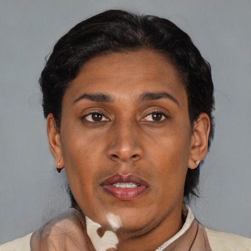 Joyful latino adult female with short  brown hair and brown eyes