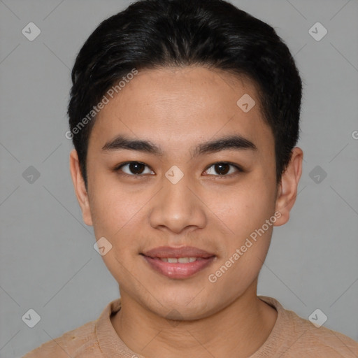 Joyful asian young-adult male with short  black hair and brown eyes