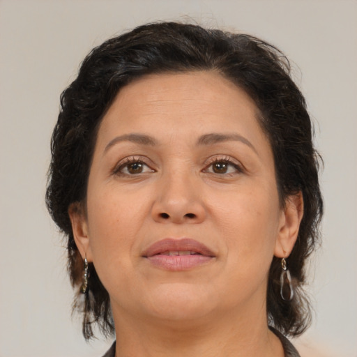 Joyful asian adult female with medium  brown hair and brown eyes