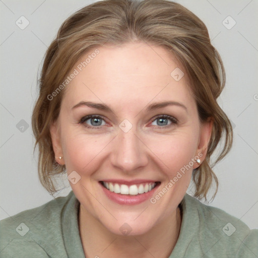 Joyful white young-adult female with medium  brown hair and blue eyes