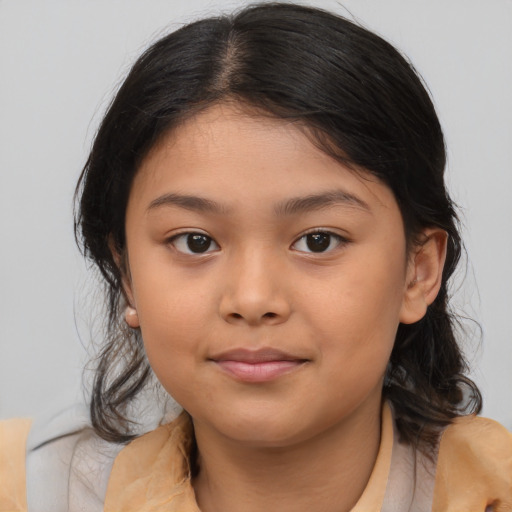 Joyful asian child female with medium  brown hair and brown eyes