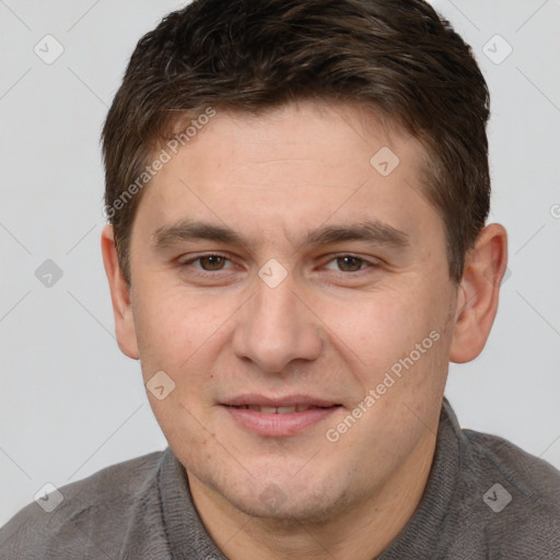 Joyful white young-adult male with short  brown hair and brown eyes