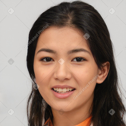 Joyful latino young-adult female with long  brown hair and brown eyes