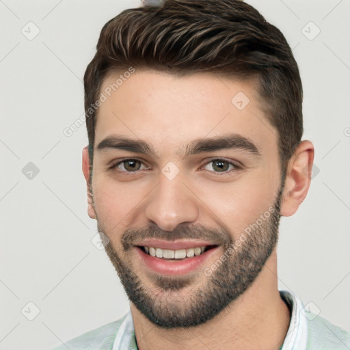 Joyful white young-adult male with short  black hair and brown eyes