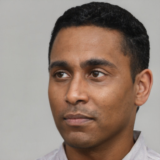 Neutral latino young-adult male with short  black hair and brown eyes