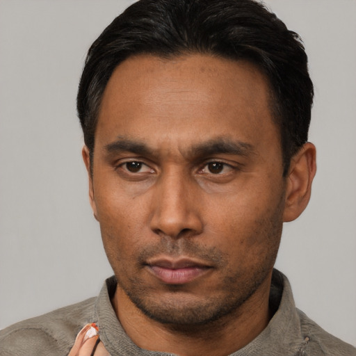Neutral asian adult male with short  black hair and brown eyes