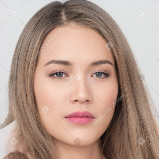 Neutral white young-adult female with long  brown hair and brown eyes