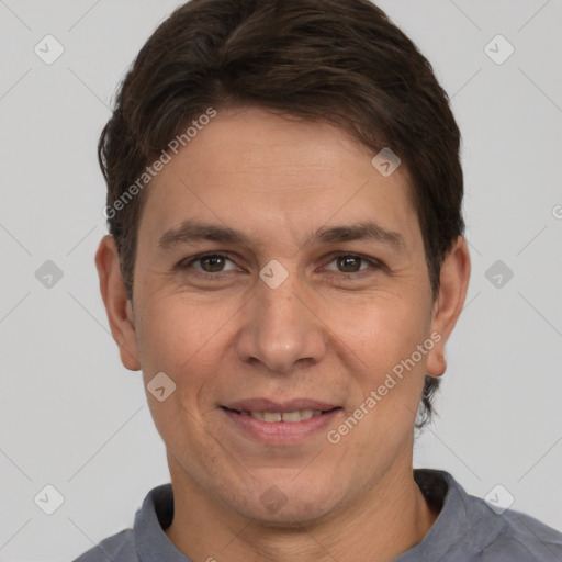 Joyful white adult male with short  brown hair and brown eyes