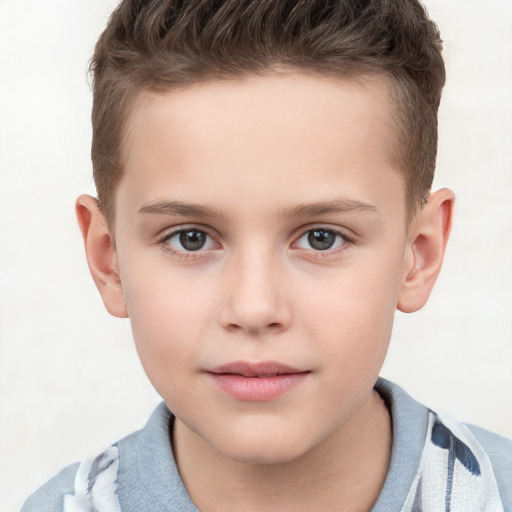 Joyful white child male with short  brown hair and brown eyes