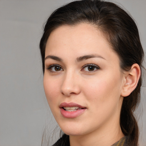 Joyful white young-adult female with long  brown hair and brown eyes